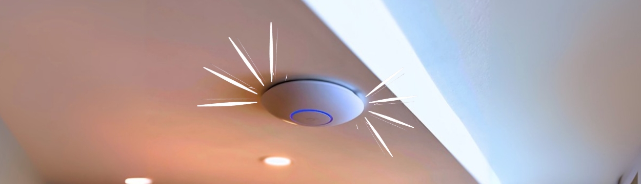 A sleek Wi-Fi access point mounted on a ceiling, representing LongFi Solutions’ ability to enhance connectivity without new installations